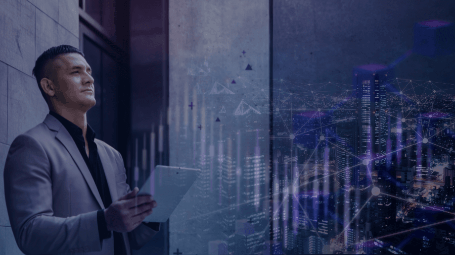 Man in business suit with tablet in hand and a contemplative look on his face. The man is staring off into the distance. There is a superimposed image of a city scape and connected dots to illustrate block chain.