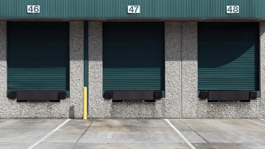 Green coloured warehouse roller doors